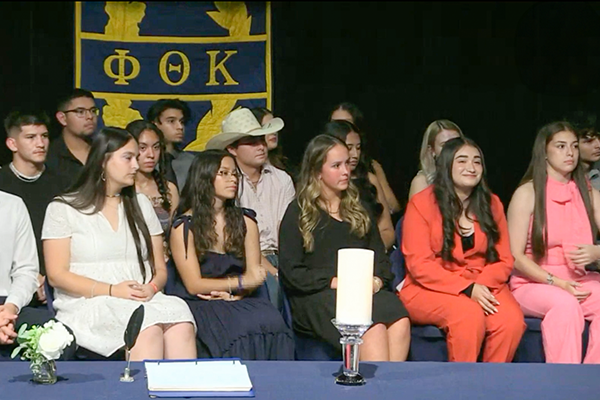 Student Organizations - Photo of students being inducted into the Phi Theta Kappa Eta Beta Chapter organization.