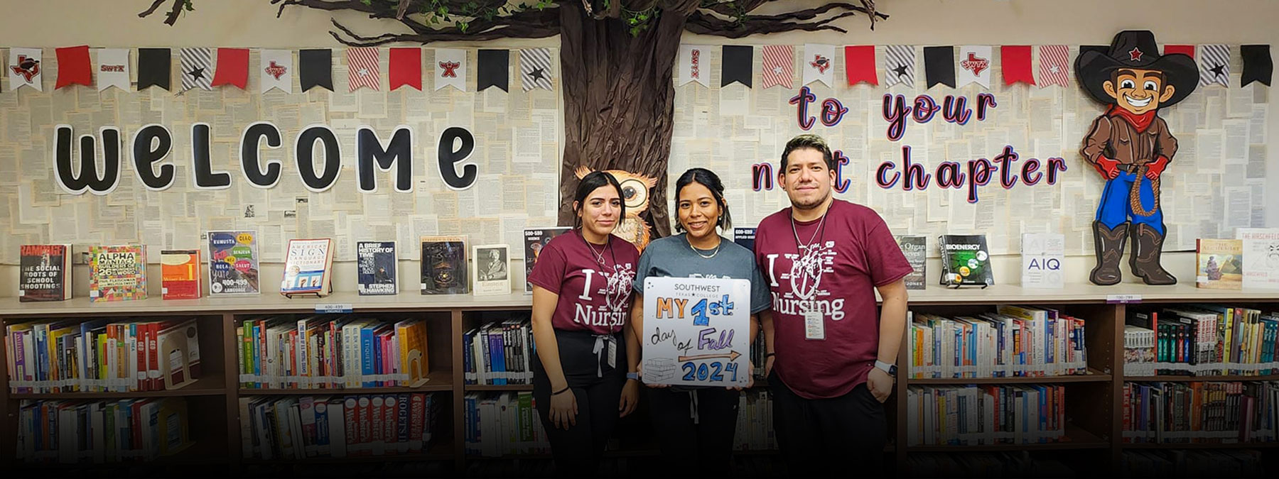 Eagle Pass students pose for first day of class pics at the campus library.