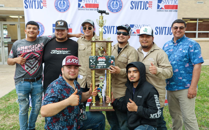 2024 Grillin' with the President Cookoff winners from the Welding Technology Team pose alongside SWTJC President Hector Gonzales with winning trophy.